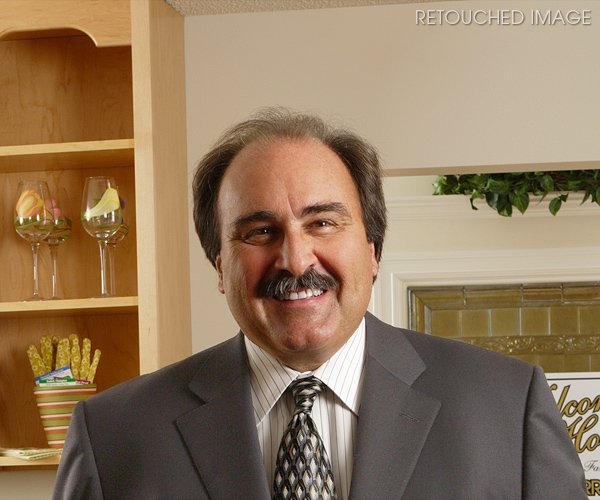 CLIENT :<br>First Niagara Financial Group, Inc.<br><br>RETOUCHING INCLUDES:<br>1) Lighten suit color<br>2) Remove flyaway hair and certain wrinkles and blemishes throughout the face while evening skin tone<br>3) Whiten teeth<br>4) Remove overhead lamp and shadow